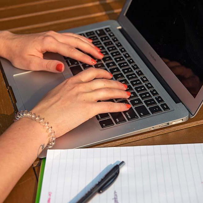 Closeup of hands on laptop